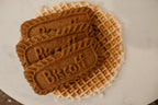Biscoff and waffle on a white plate