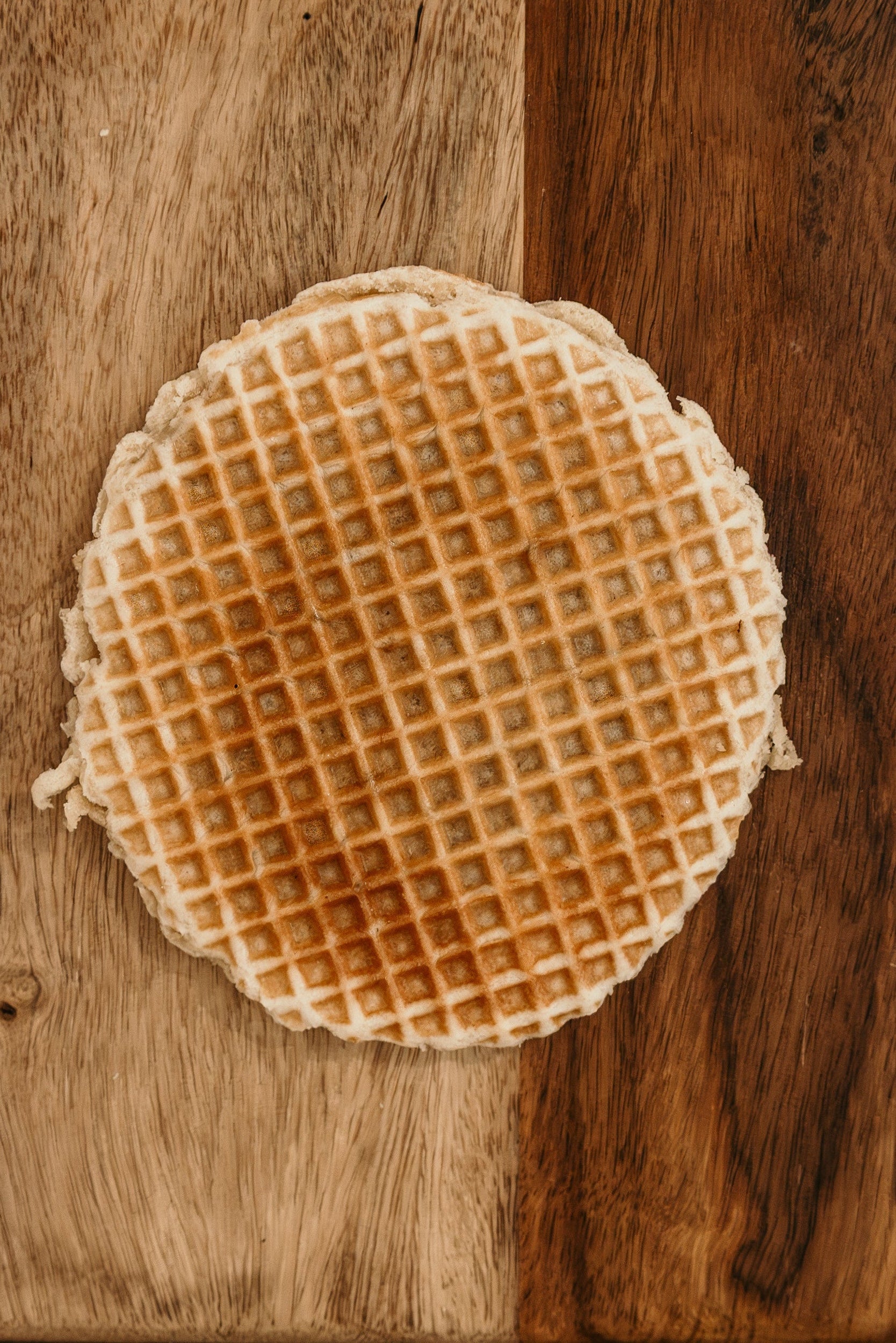 Round waffle on a wooden surface