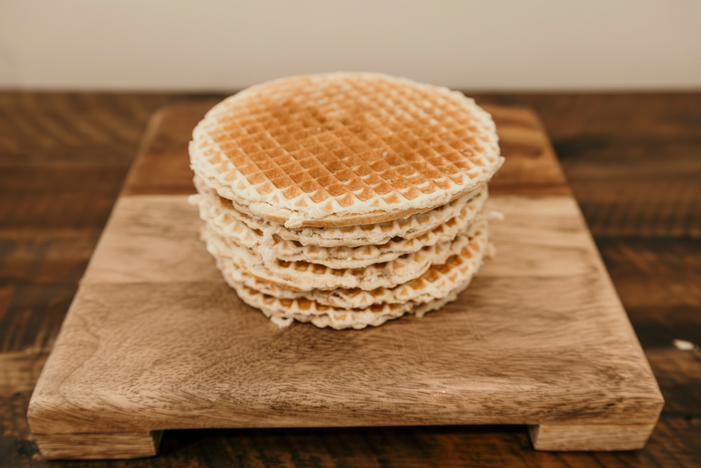 Stack of waffles on wooden board